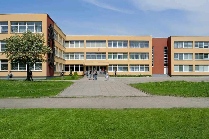 shutterstock_590214395 School building with three stories and wide windows