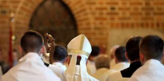 Pope’s Lung Scare Triggers Vatican Whispers Bishop in white mitre among clergy during church procession