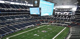Election-Eve Ads Spark Legal Heat American football stadium interior with large central video board